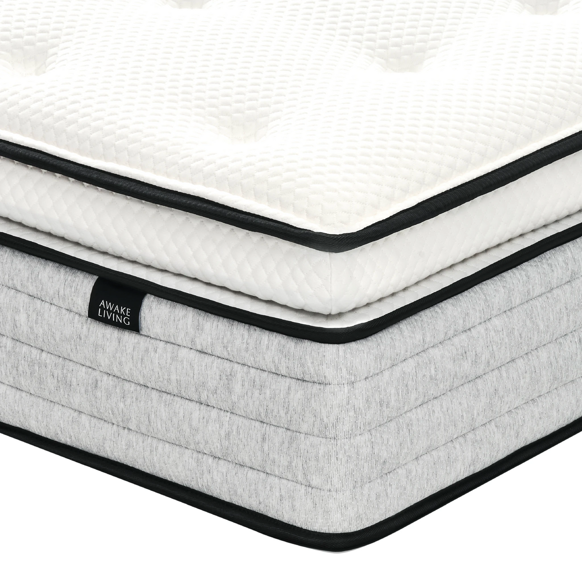 Deluxe AG 床墊的角落特寫,展示其 Pillow Top 設計與灰色橫紋床邊。